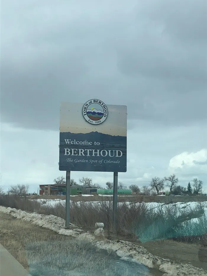 The Town of Berthoud welcome sign, The Garden Spot of Colorado, under a winter sky